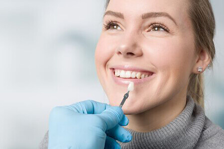 Woman being fitted for dental veneers